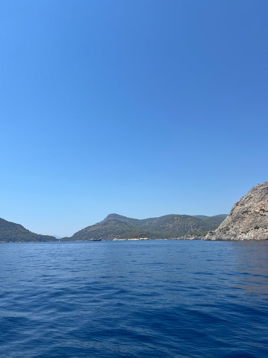 Deep Blue Aegean Sea Rocky Coastline and Pine Covered Mountains Turkish Mediterranean Coast Turkey