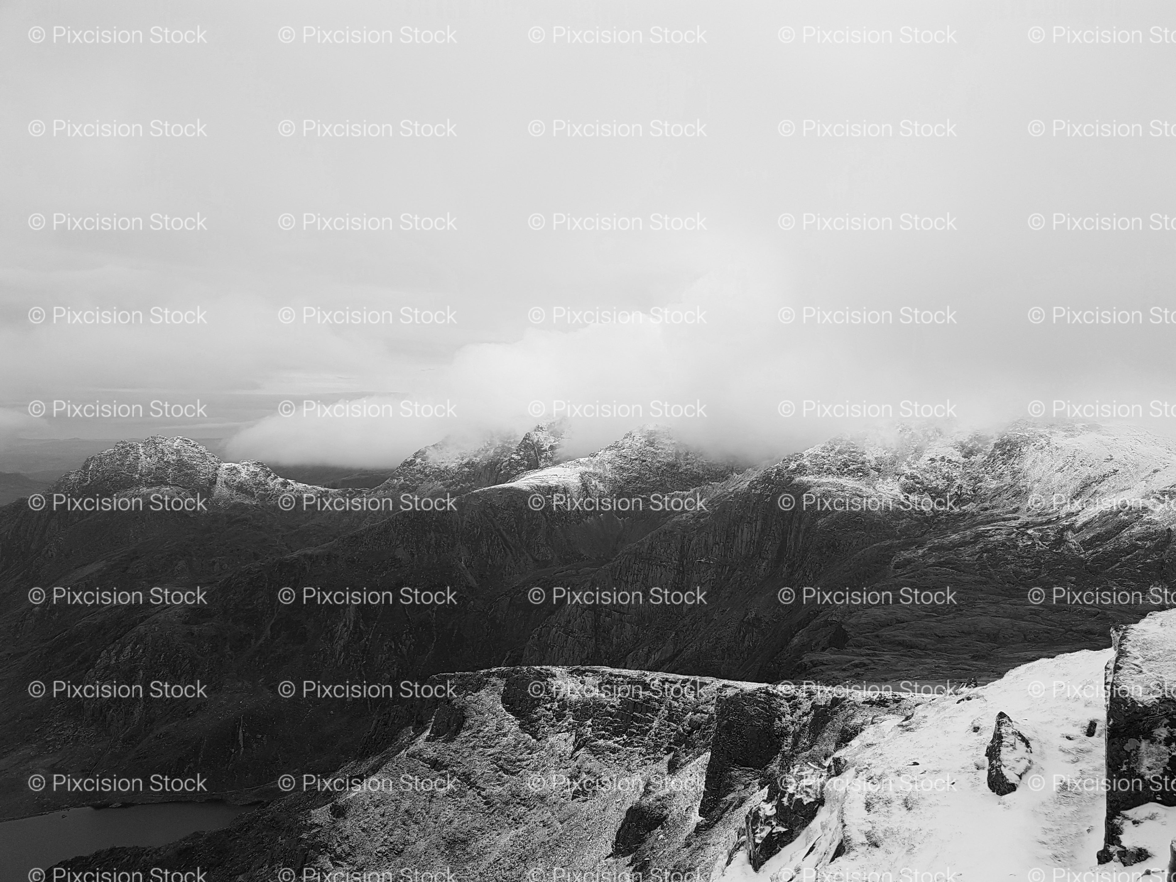 Panoramic View of Misty Mountain Peaks (Monochrome)