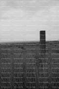Solitary Wooden Fence Post Against a Misty Background (Monochrome)