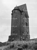 Historic Stone Watchtower or Monument on a Hillside (Monochrome)