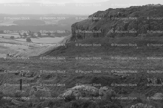 Wide Landscape View of a Distant Coastal Valley or Bay (Monochrome) - Stock Video