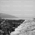 Elevated View Overlooking a Coastal Town from a Roof Top (Monochrome)