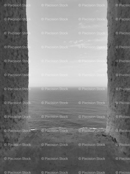 Narrow Vertical View Framed by Stone Pillars looking toward the Horizon (Monochrome) - Stock Video