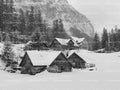 Rustic Wooden Cabins Nestled in a Deep Winter Snowscape (Monochrome)