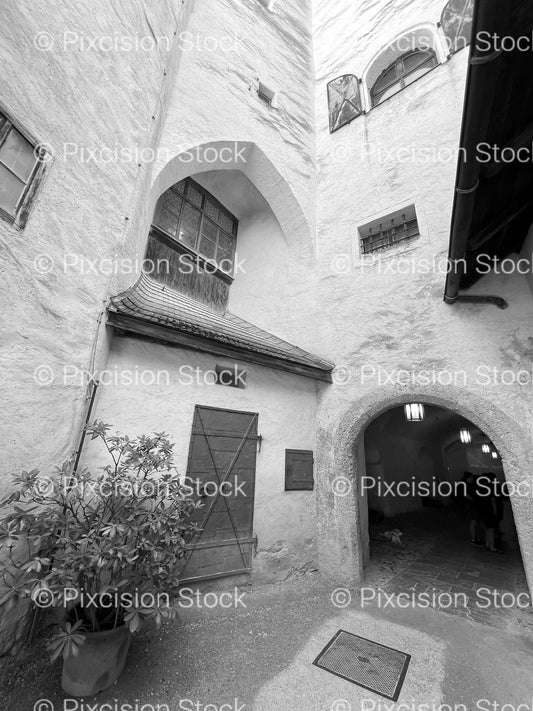 Narrow Stone Courtyard Between Historic Stucco Buildings (Monochrome) - Stock Video
