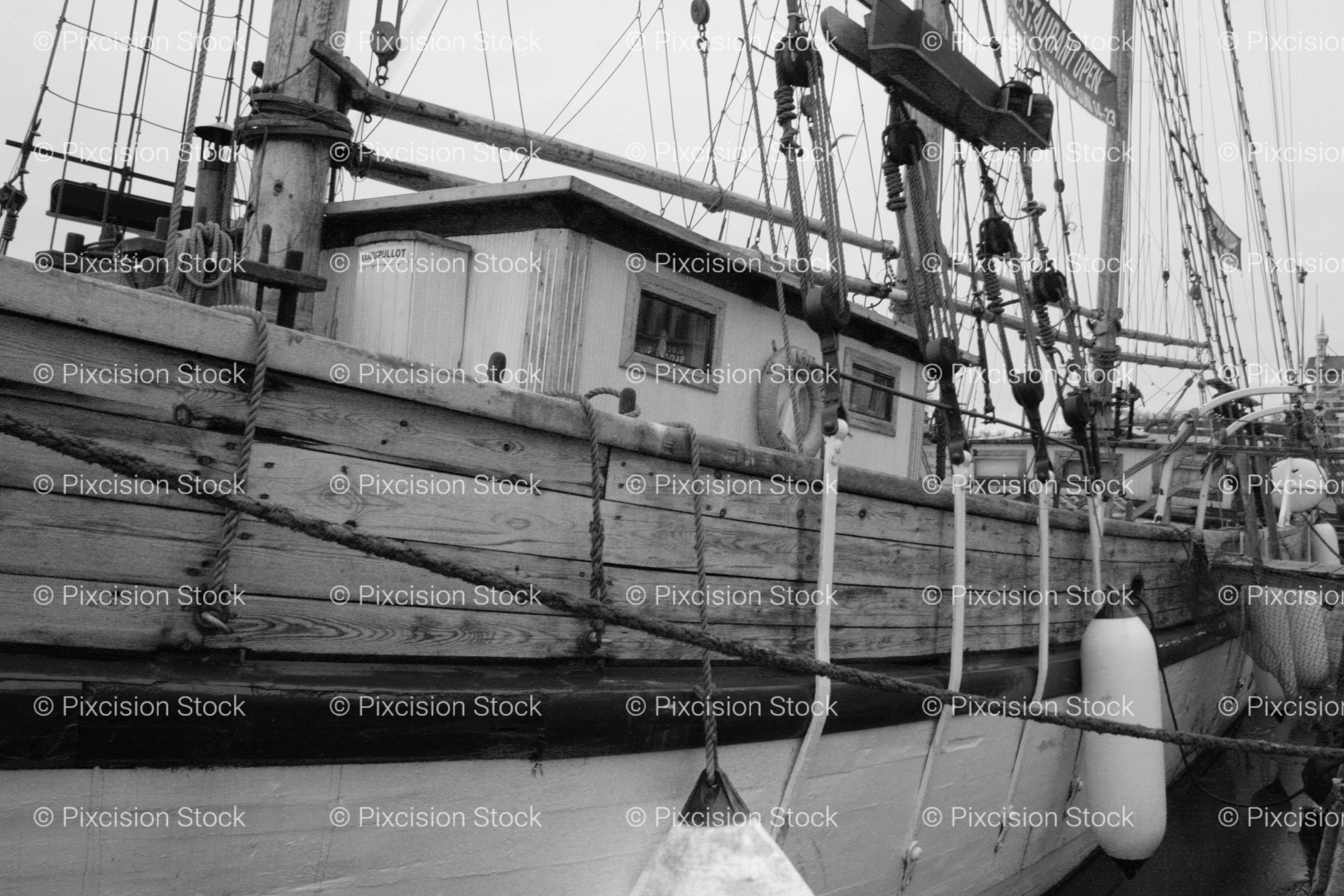 Side View of a Wooden Ship Hull with Rigging and Fenders (Monochrome)