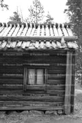 Square Window on a Rustic Wooden Log Building (Monochrome)