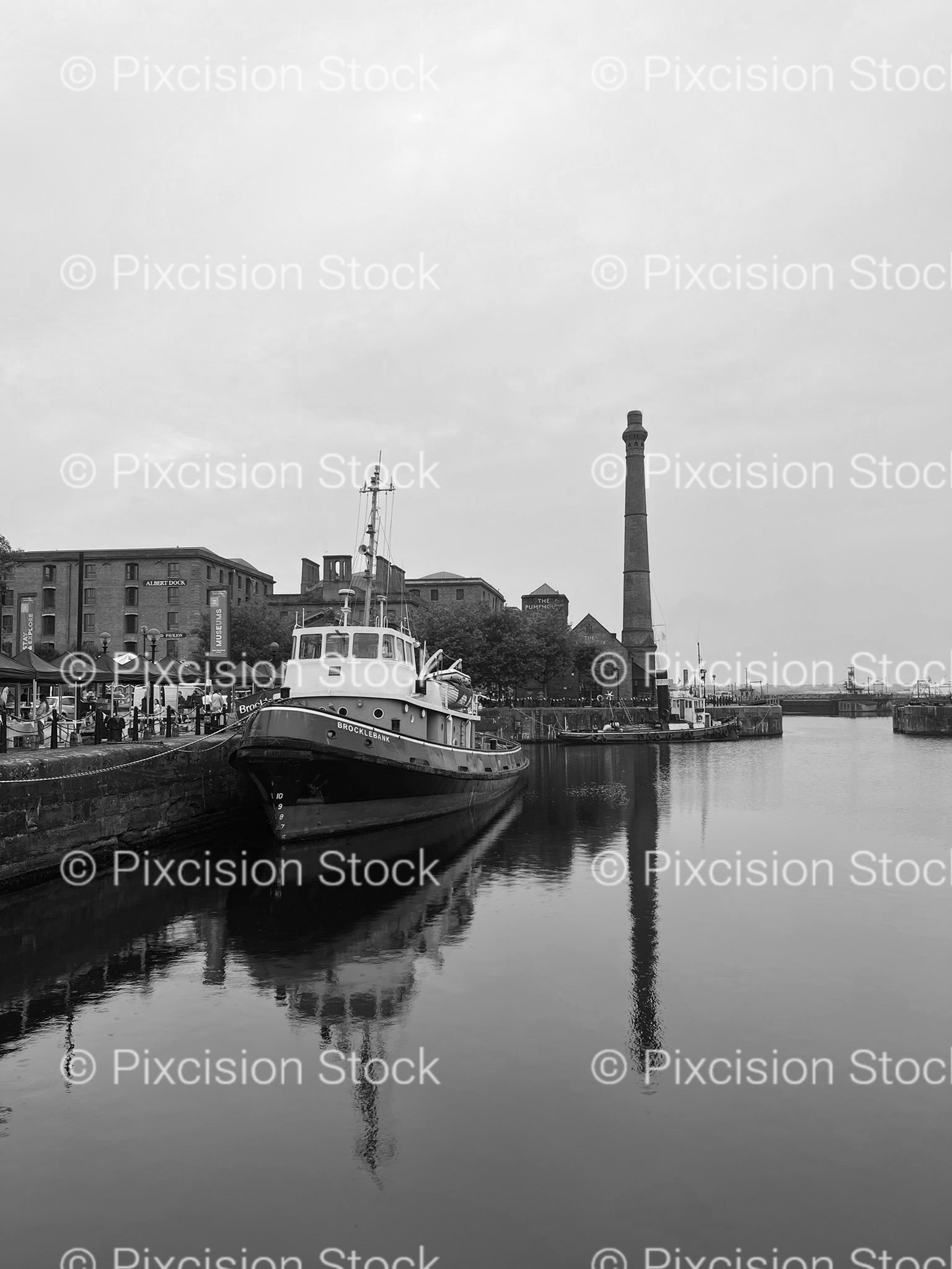 Small Ship Docked in a Narrow Urban River Channel (Monochrome)
