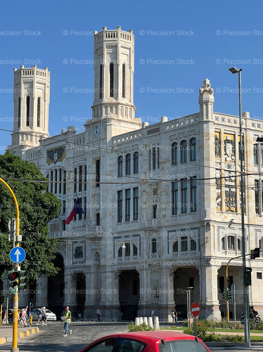 Palazzo Civico Cagliari City Hall Facade with Twin Towers Against a Clear Blue Sky