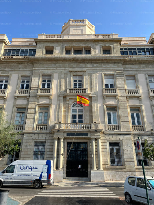 Neoclassical Spanish Government Building Facade with Spanish Flag