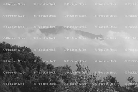 Wide View of a Mountain Peak Partially Shrouded in Mist (Monochrome)