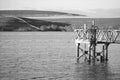 Elevated Footbridge Pier on the Edge of a Wide Lake (Monochrome)
