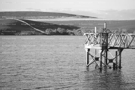 Elevated Footbridge Pier on the Edge of a Wide Lake (Monochrome) - Stock Video