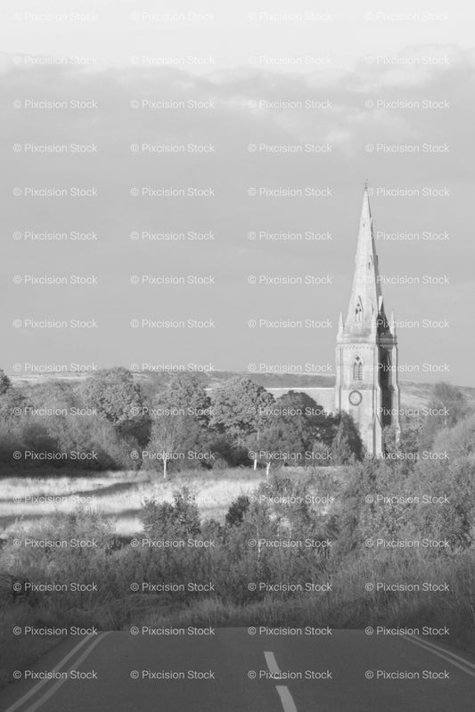 Country Path Guiding the Eye Toward a Historic Church Tower (Monochrome) - Stock Video