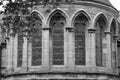 Symmetrical Row of Arched Windows on a Medieval Stone Facade (Monochrome)