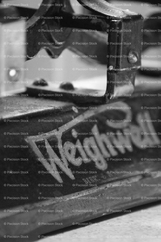 Close-Up Detail of Vintage Farm Machinery Branded "Weighwell" (Monochrome)