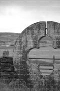 Close-Up Profile of a Unique Circular Stone Gate Entrance (Monochrome)