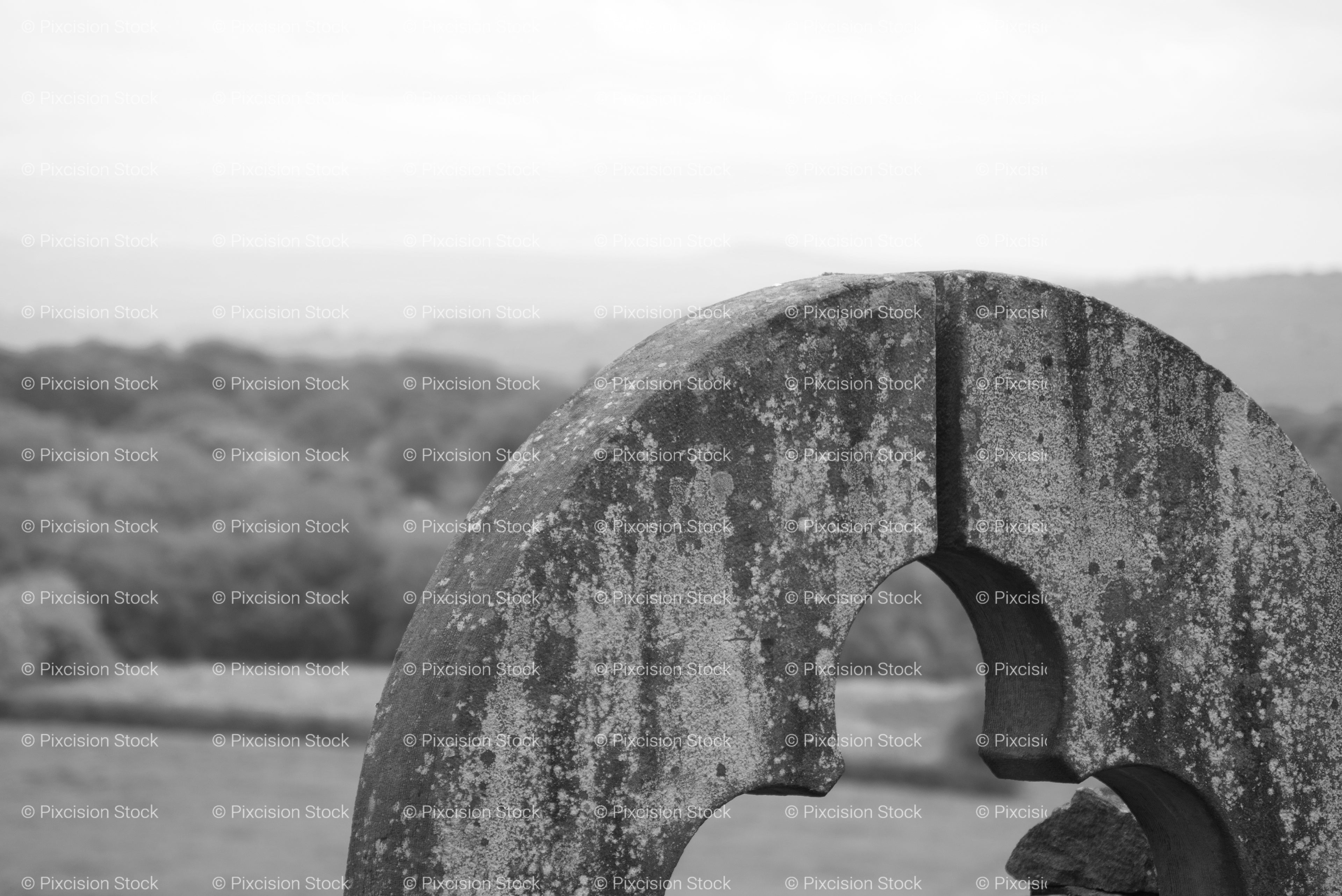 Low-Angle View of a Large Arched or Circular Stone Structure (Monochrome)