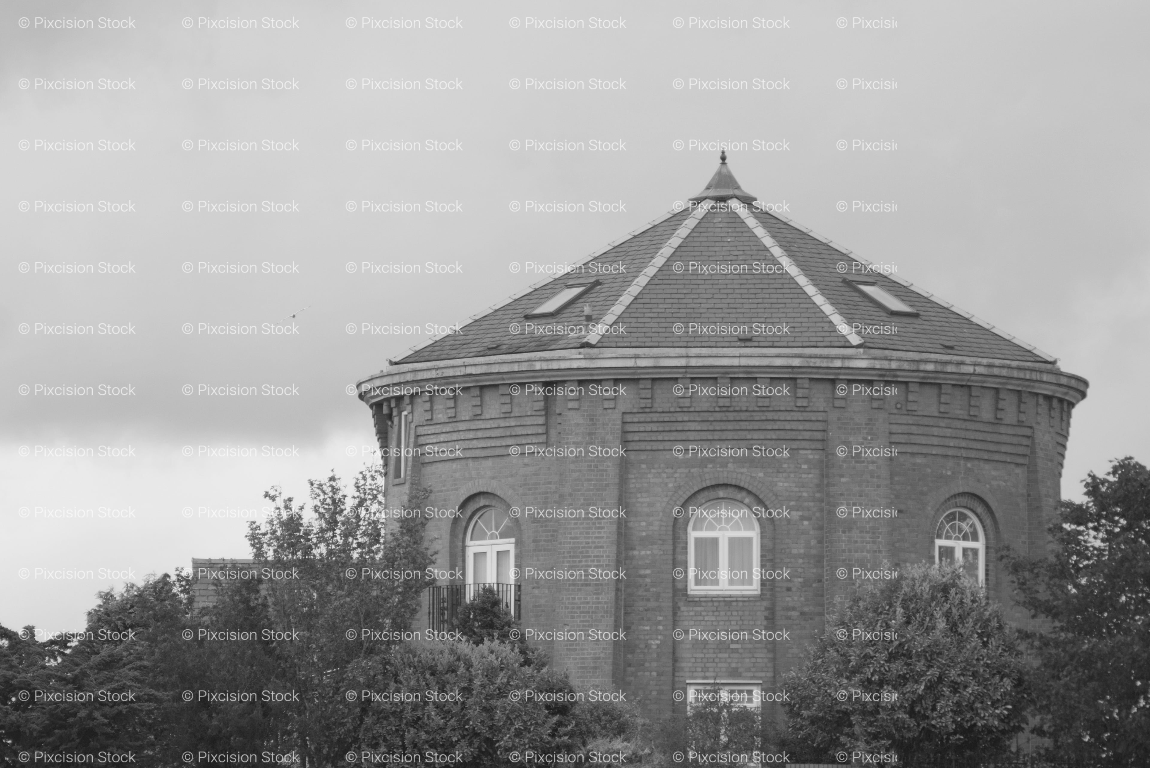 Wide Exterior View of an Old Octagonal Brick Structure (Monochrome)