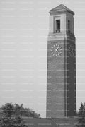 Tall Free-Standing Brick Clock Tower Reaching Toward the Sky (Monochrome)