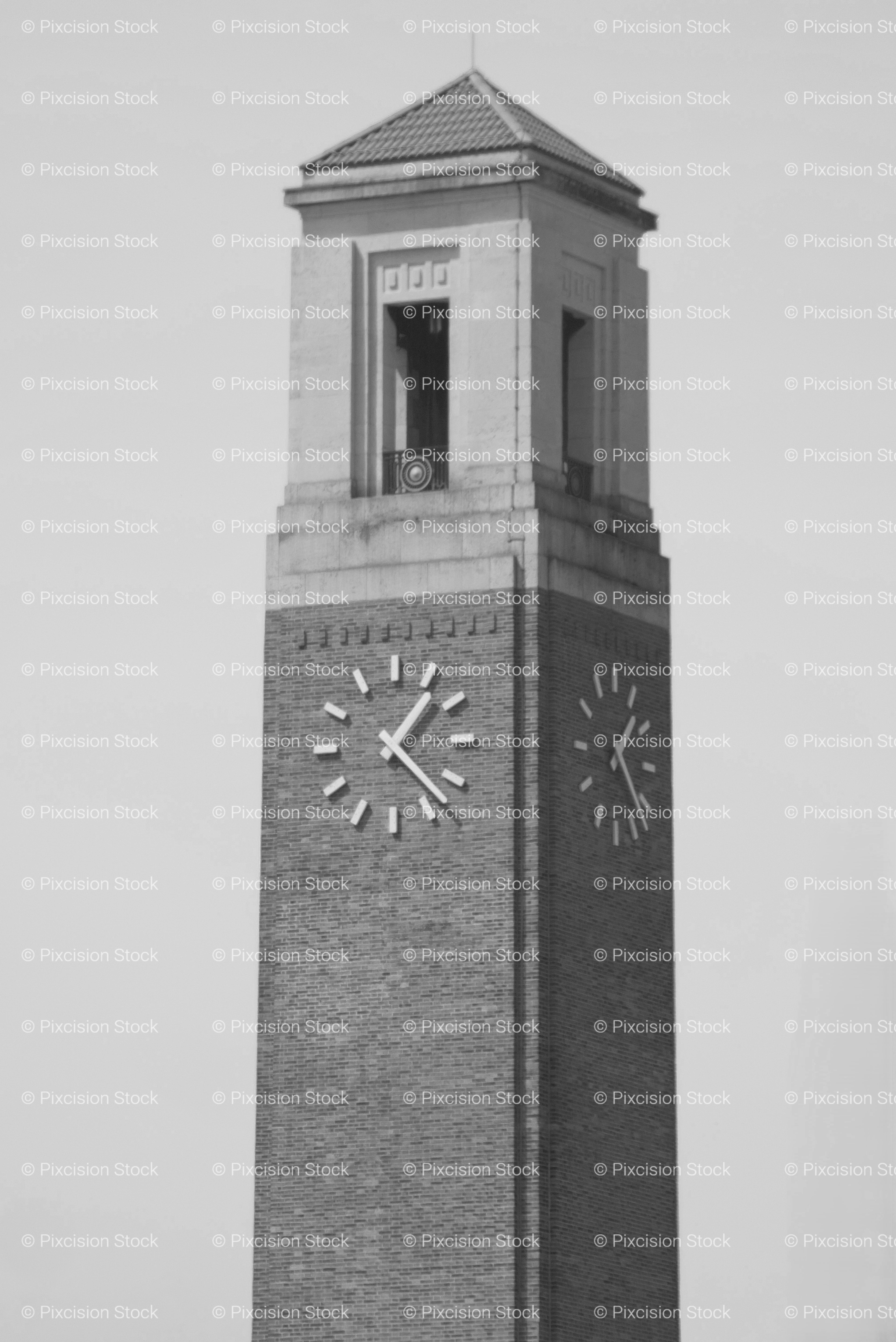 Tall Brick Clock Tower Against a Plain Sky (Monochrome)