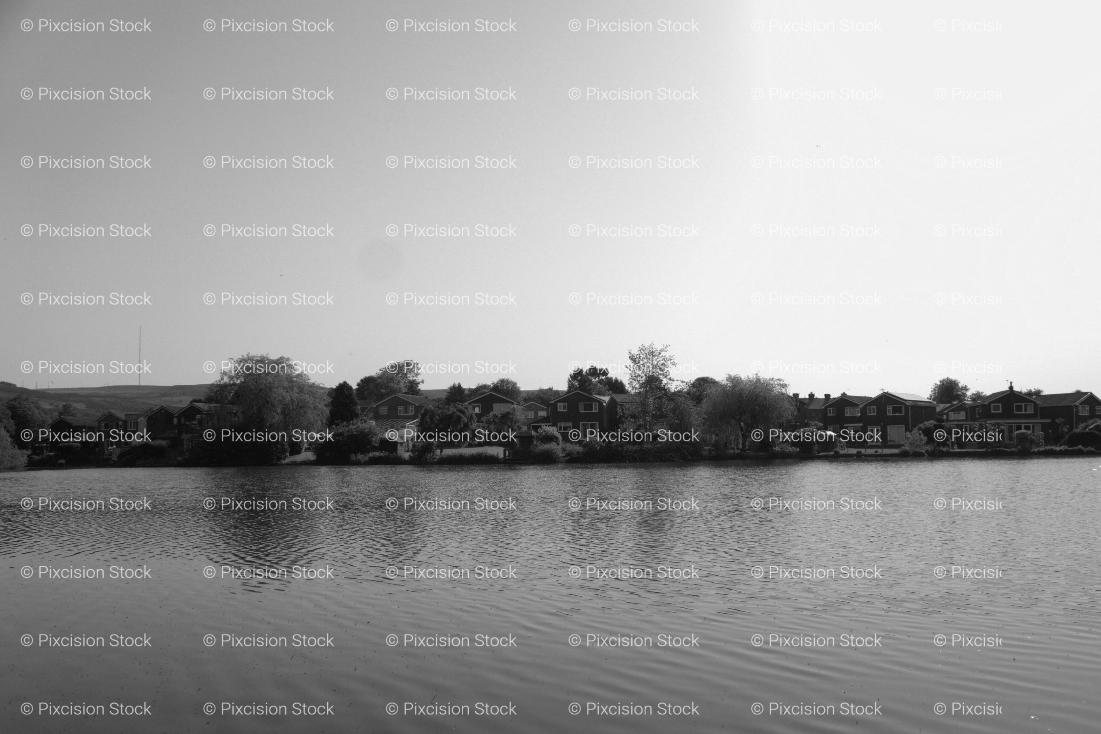 Panoramic View of a Wide River Under a Clear Sky (Monochrome)
