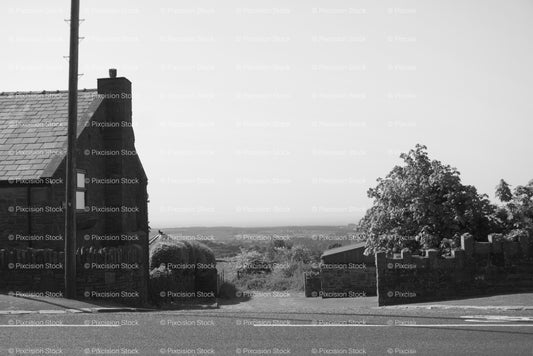 Rural Landscape Featuring a Stone Building and Vast Open Fields (Monochrome) - Stock Video