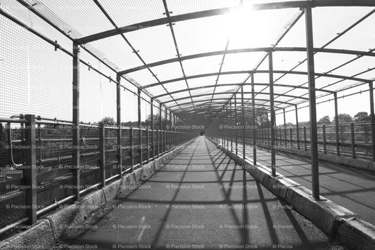 Perspective View Down a Long, Covered Outdoor Walkway with Metal Framework (Monochrome) - Stock Video