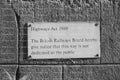 Stone Wall Sign Displaying a "Highways Act 1980" Notice (Monochrome)