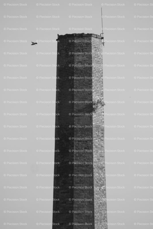 Close-Up of the Top of an Industrial Brick Chimney Against the Sky (Monochrome) - Stock Video