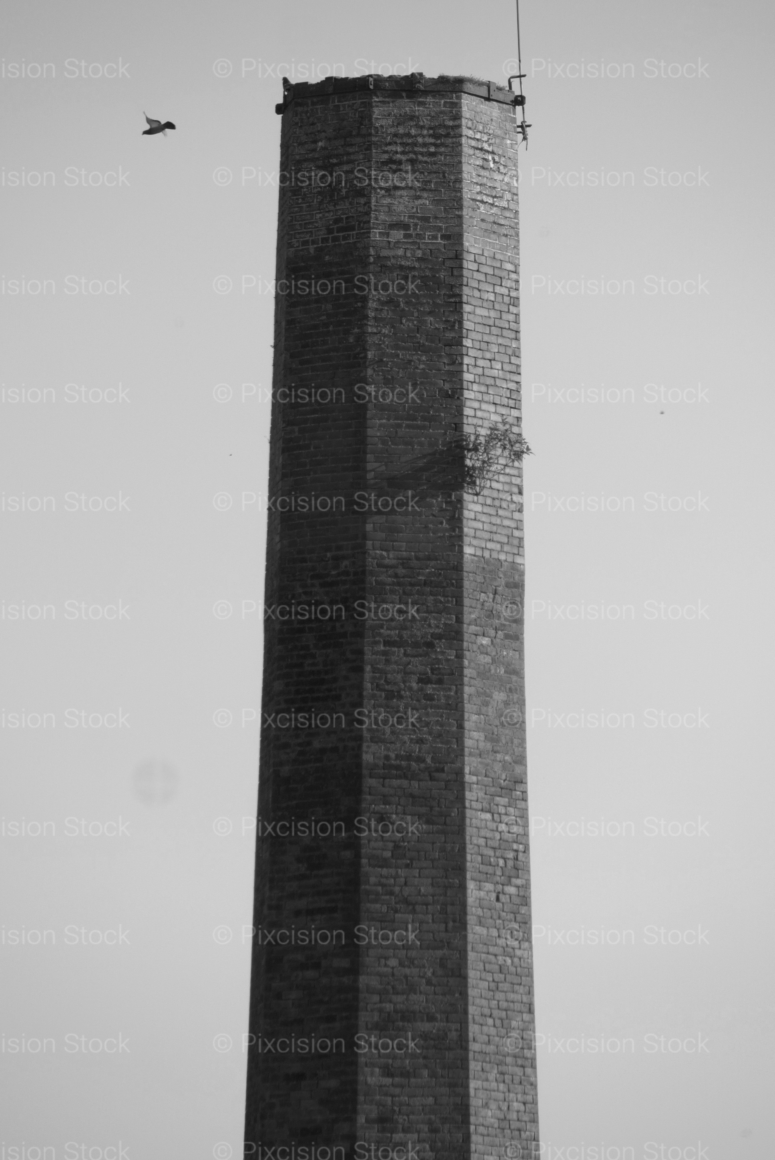 Close-Up of the Top of an Industrial Brick Chimney Against the Sky