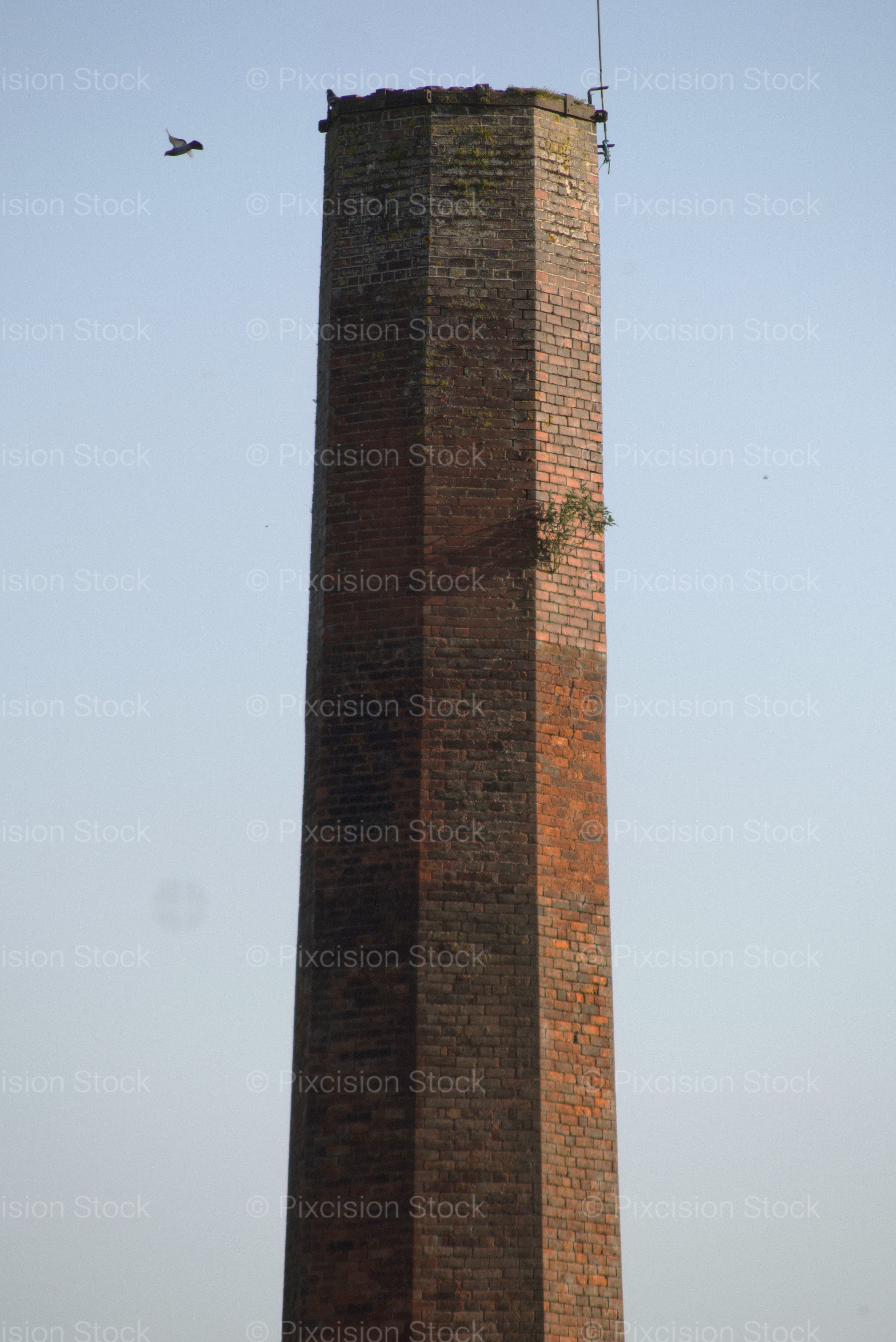 Close-Up of the Top of an Industrial Brick Chimney Against the Sky - Stock Video