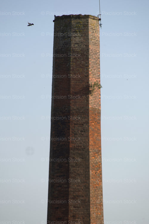 Close-Up of the Top of an Industrial Brick Chimney Against the Sky - Stock Video