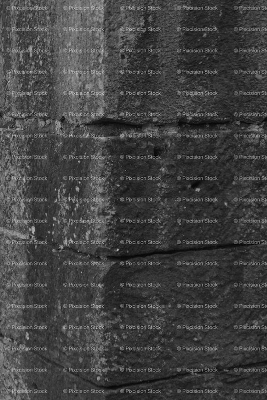Vertical Abstract Shot of a Weathered Stone Pillar (Monochrome)