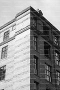 Corner Angle View of an Old Brick Industrial Mill Tower (Monochrome)