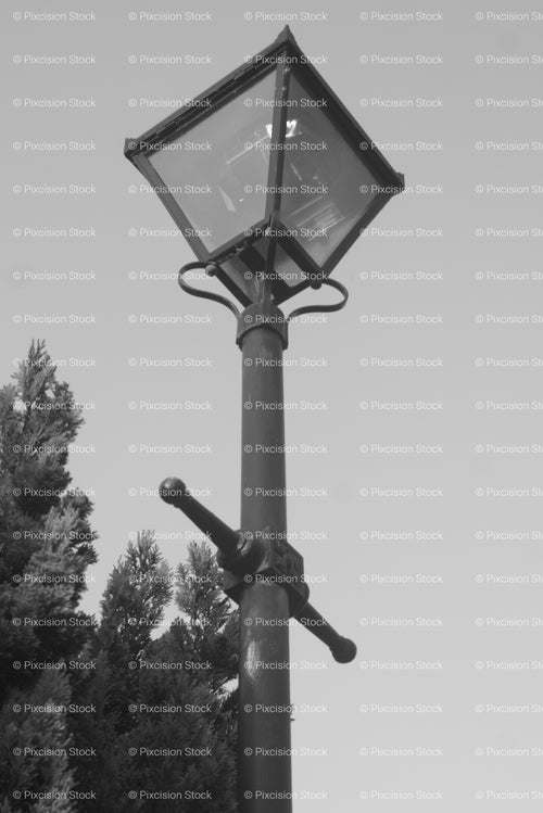 Close-Up View of a Vintage Gas-Style Lamppost Against the Sky (Monochrome) - Stock Video