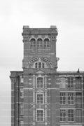 Ornate Brick Architecture of a Historic Mill Tower (Monochrome)