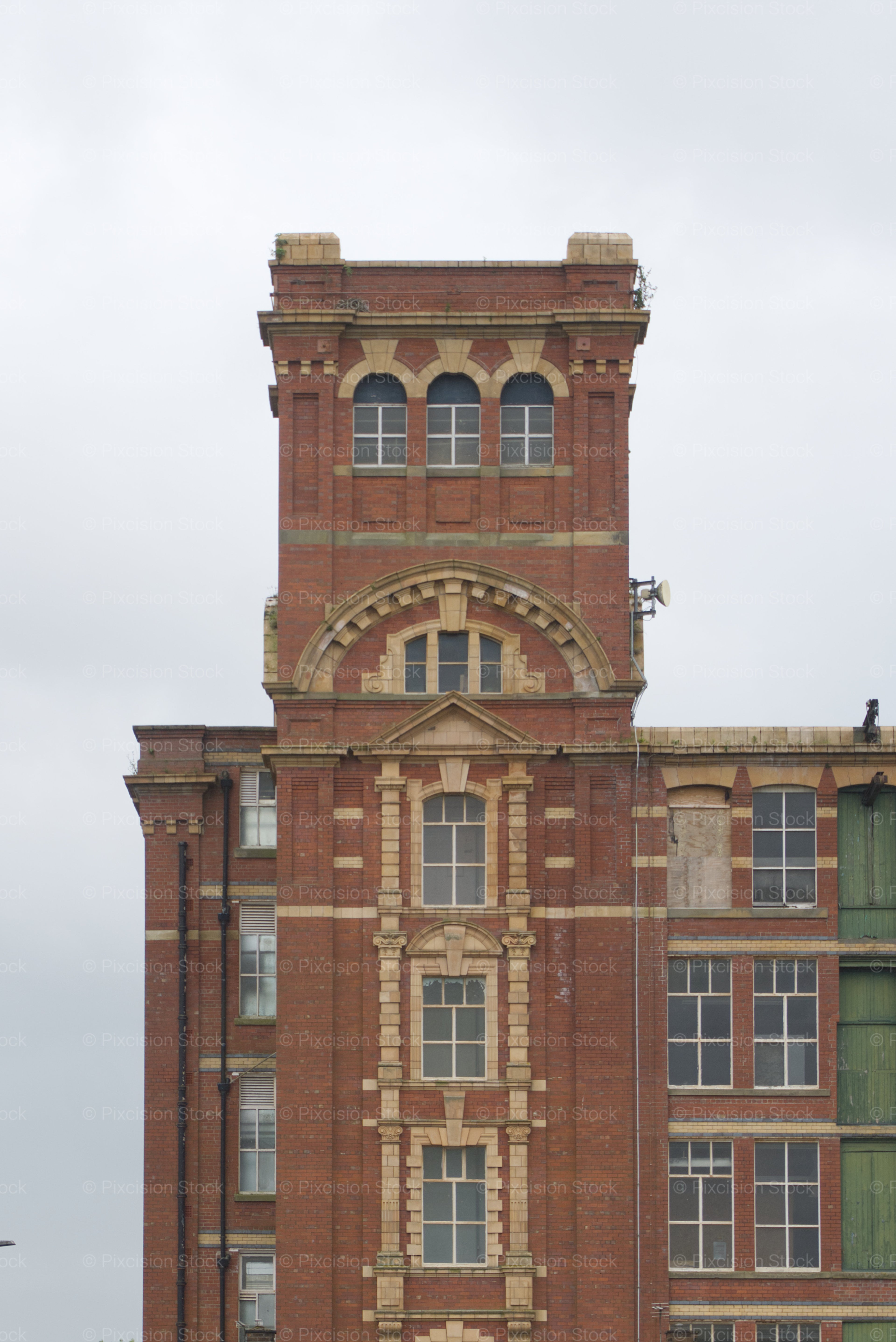Ornate Brick Architecture of a Historic Mill Tower