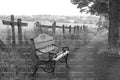 Wooden Park Bench Beside a Country Path and Fence (Monochrome)