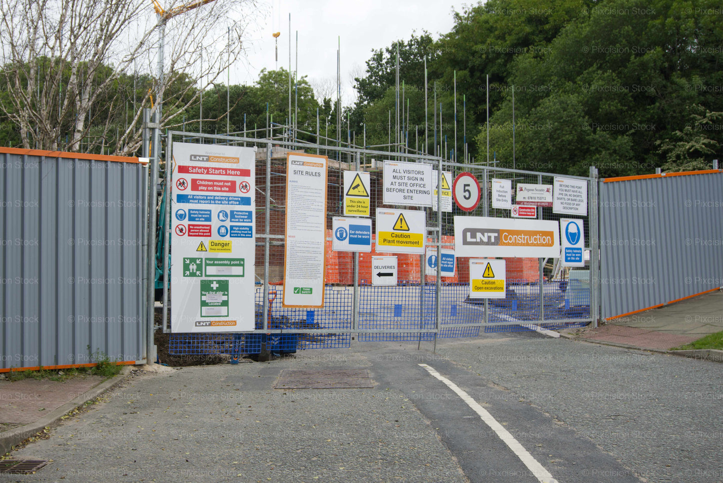 Construction site with various signs and barriers