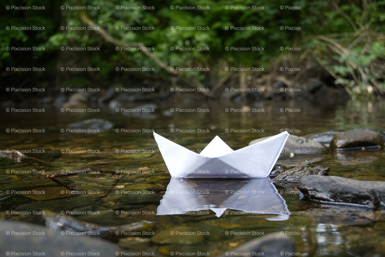 White Paper Boat Floating on a Calm Water Surface - Stock Video