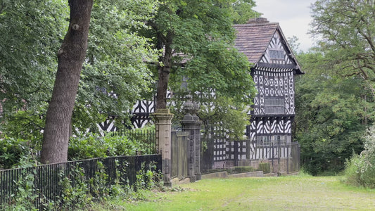 A video tour exploring the historic timber-framed architecture and grounds of Hall i' th' Wood Tudor manor house.